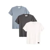 Pack de tres remeras básicas de manga corta y cuello redondo. Incluye una remera azul claro jaspeado, una gris oscuro jaspeado y una blanca lisa.