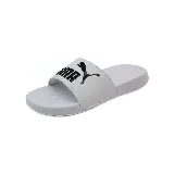 Chinelas Puma PopCat 20 blancas con logo Puma en negro en la tira superior.