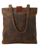 Bolso tote de cuero marrón con paneles de cuero peludo en los laterales y base de cuero liso. Tiene doble asa de hombro y correa bandolera ajustable y extraíble. El compartimento principal tiene cierre de cremallera y múltiples bolsillos interiores.