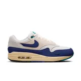 Championes Nike Air Max 1 de hombre, color blanco, azul y beige con detalles en verde.