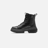 Botas de cuero negro con cordones, cremallera lateral y suela de goma con plataforma.