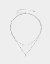 Collar corto de doble cadena plateada con dije de estrella con cubic zirconia.