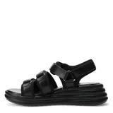 Sandalia beige con plataforma, tobillera y tiras con ajuste de velcro.