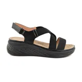 Sandalias de mujer color beige con tiras cruzadas elásticas y suela de plataforma.