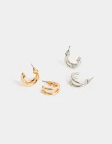 Set de cuatro pares de aros tipo argolla dobles, dos plateados y dos dorados.