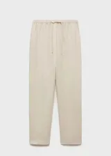 Pantalón de lino color beige, de corte recto, con cintura elástica ajustable con cordón.