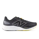 Championes de running New Balance 680 V8 para hombre, color negro con detalles en gris y amarillo.