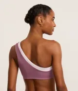 Top deportivo de microfibra color lila con detalle bicolor blanco, hombro único, escote asimétrico y gota vazada.