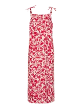 Vestido largo sin mangas con estampado floral rojo sobre fondo blanco, cuello cuadrado y tiras para anudar en los hombros.