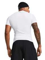 Remera de compresión blanca Under Armour HeatGear de manga corta con logo negro en el pecho y en la banda para el pelo.