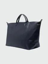 Bolso de viaje Longchamp modelo Le Pliage Xtra, color azul marino, con doble asa corta y correa larga extraíble.