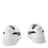 Championes Puma modelo Carina 2.0 para mujer, color blanco con franja lateral (Formstrip) negra. Presentan una plataforma gruesa con textura acanalada en la puntera y el talón, y cordones blancos.