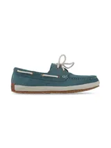 Mocasines náuticos de cuero azul marino con cordones marrones, ojales metálicos y suela de yute.