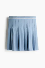 Minifalda celeste de punto con cintura elástica y tableada.