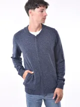 Campera de punto azul melange con cierre frontal y diseño holgado.