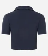 Blusa polo azul marino de rib de algodón, con cuello en V y manga corta.