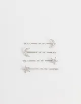 Set de cuatro horquillas plateadas para el pelo, dos con apliques de luna y dos con apliques de estrella, ambos con incrustaciones de strass.
