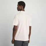 Chomba rosa de piqué de algodón con cuello clásico y tapeta de dos botones.