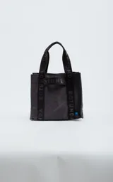 Cartera tipo tote bag color gris oscuro, con asas cortas y estampado de la palabra "Rotunda" en negro.
