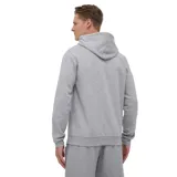 Canguro Adidas gris con capucha y cordones ajustables, bolsillo tipo canguro y logo bordado en el pecho. Presenta las tres rayas características de la marca en color blanco a lo largo de las mangas.