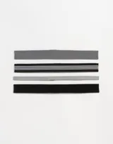 Set de cuatro vinchas elásticas deportivas de distintos anchos y colores: gris oscuro, negro con tres líneas blancas, gris claro y negro liso.