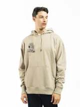 Canguro beige de corte oversize con capucha y bolsillo tipo canguro. Presenta un estampado pequeño en el pecho con un personaje de flor y la inscripción "FORUM IND".