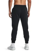 Pantalón de jogging gris de corte ajustado, con cintura elástica ajustable con cordón, bolsillos laterales con cierre y logo de Nike bordado en negro en la pierna izquierda.