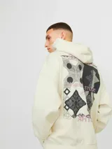 Canguro color crema con capucha y manga larga, de corte oversize y tejido loop back.
