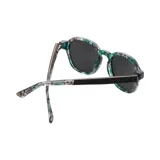 Lentes de sol redondos con marco de acetato con estampado abstracto en tonos verde, gris y blanco.