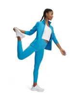 Calza deportiva Under Armour Motion Ankle Leg color azul con pretina alta, logo estampado en la cadera y bolsillo lateral.