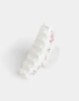 Broche para el pelo de acrílico blanco con apliques de strass de colores.