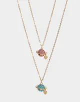 Set de 2 collares dorados para compartir, con cadena de eslabones y dije de planeta con strass rosas y celestes, y dije de corazón.