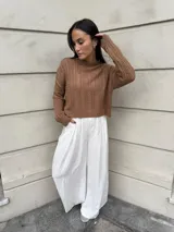 Sweater tejido de punto color rosa con diseño de ochos.