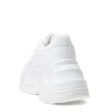 Zapatillas deportivas color beige con plataforma gruesa y acordonadas.