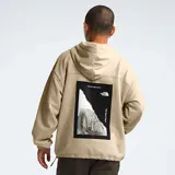 Hoodie beige de The North Face con logo estampado, bolsillos laterales y corte oversize.