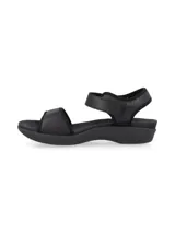 Sandalias blancas con detalles en gris, con ajuste de velcro en el tobillo y suela anatómica.