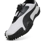 Championes Puma Mostro Perf en blanco con detalles en negro, con suela con protuberancias.