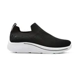 Championes deportivos negros sin cordones, con capellada tejida y suela blanca con diseño ondulado.