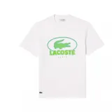 Camiseta blanca de algodón con cuello redondo y logo de Lacoste en el pecho, dentro de un óvalo verde.