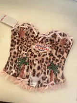 Corset elastizado animal print con detalles de encaje y moños en rosa.