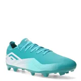 Championes de fútbol Umbro Vibe HG color turquesa con detalles en blanco.