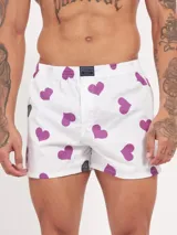 Bóxer de algodón con estampado floral en tonos azul y blanco, con cintura elástica y logo de la marca en el centro.