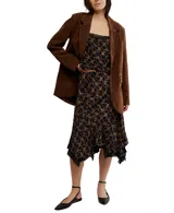 Top negro con estampado floral, escote recto con encaje, espalda abierta con tirantes regulables y sin mangas.