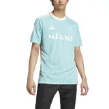 Camiseta de fútbol Adidas del Inter Miami CF, modelo 2024, tercera equipación. Diseño celeste con rayas verticales en relieve, detalles en naranja en cuello y laterales, y las tres tiras de Adidas en los hombros. Incluye el escudo del club y el logo de Adidas en el pecho, y el nombre "Miami" en el frente.