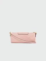 Bandolera Longchamp modelo Le Pliage Xtra, tamaño S, color terracota, con correa de cuero ajustable y cierre con botón a presión.