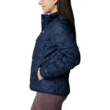 Campera acolchada Columbia para mujer, color azul marino, con cuello alto y cierre frontal. Presenta un patrón de pespunte en forma de zigzag y el logo de Columbia en el pecho.