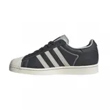 Zapatillas Adidas Superstar color gris oscuro con las tres tiras laterales en blanco y puntera de goma blanca.