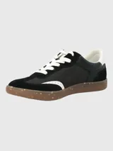 Zapatillas deportivas urbanas de mujer, color negro, con cordones blancos, suela marrón con motas de colores y detalles en blanco en el lateral.