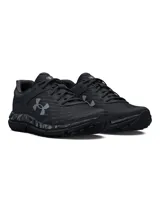 Championes Under Armour Charged Assert 10 Camo para hombre, color verde militar con detalles en negro y estampado de camuflaje en la entresuela. Zapatillas de running con Charged Cushioning® para protección contra impactos y capellada transpirable.