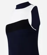 Blusa de punto sin mangas con cuello alto y bloques de color blanco, negro y azul marino.